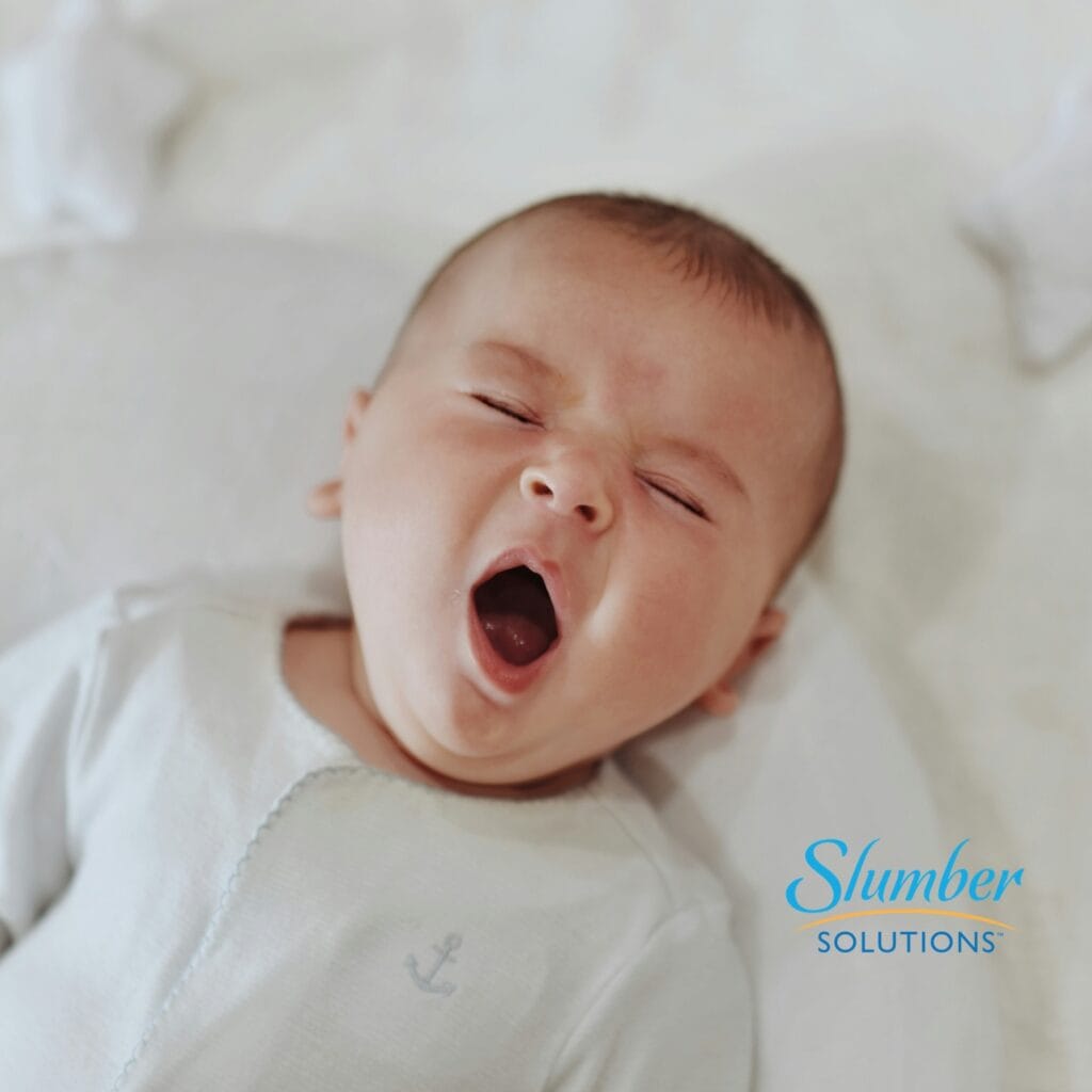 Yawning Baby in Crib